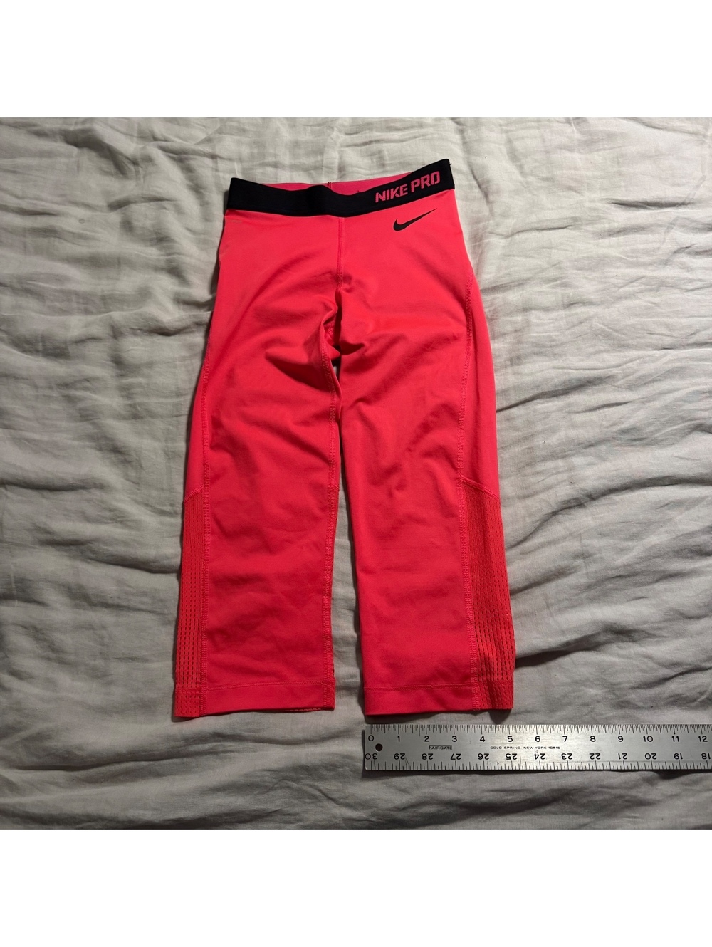 bright pink cropped Nike pro